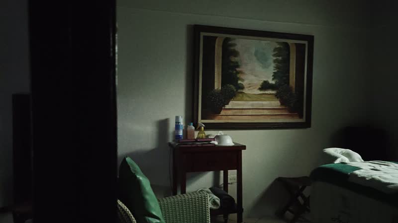 Treatment room two, with soft daylight falling through the window across the massage table